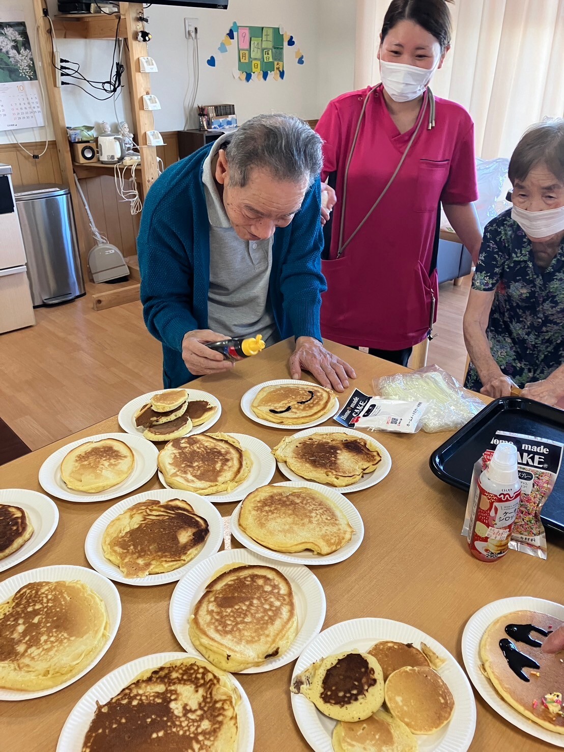 写真：利用者様とスタッフ